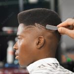 Side view of man with stylish haircut in barber shop